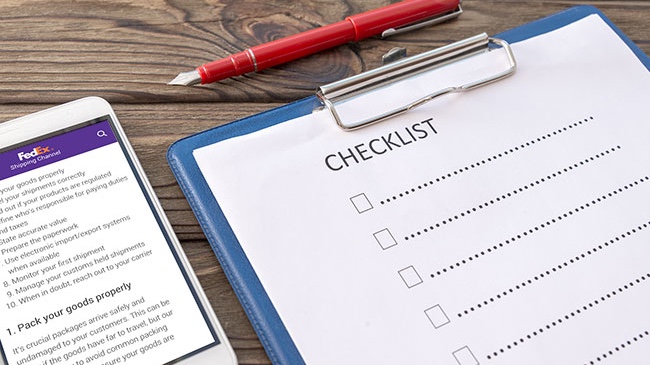 control sheet on the tablet, smartphone. A handle on a wooden background with a tola. business. finance. planning