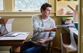 man in office with papers