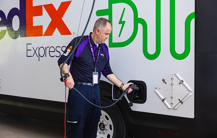 Courier Charging a FedEx EV