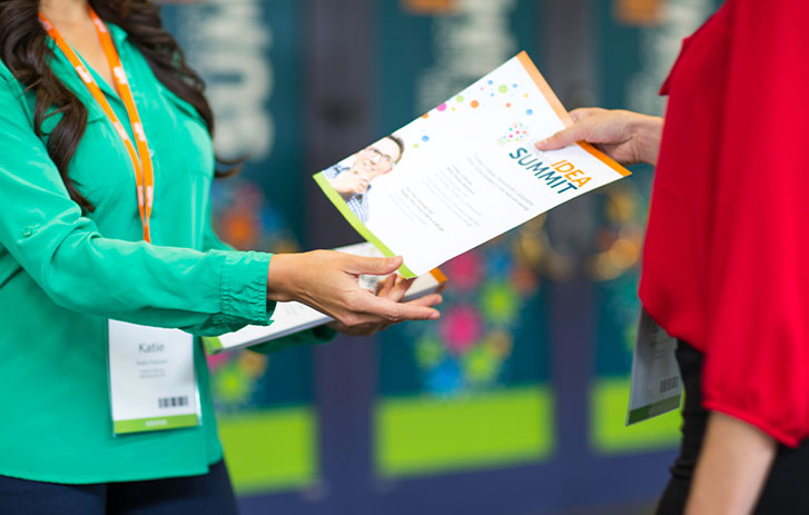 A lady handing out some flyers