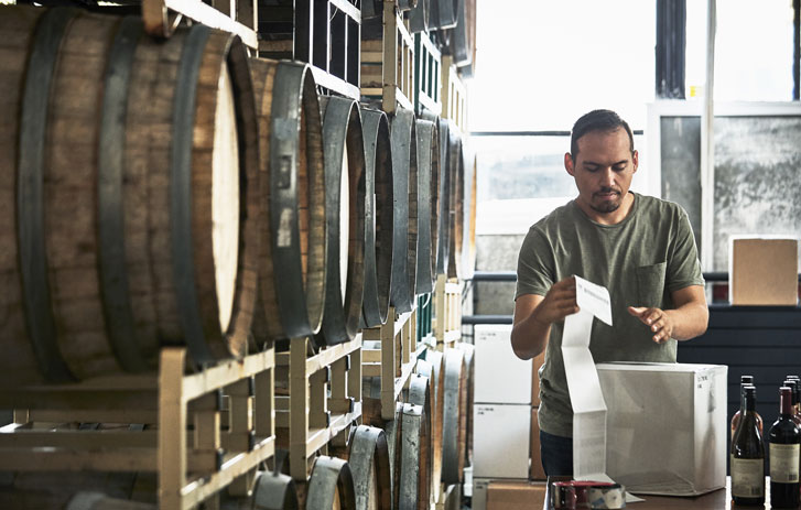 man reviewing alcohol shipping order