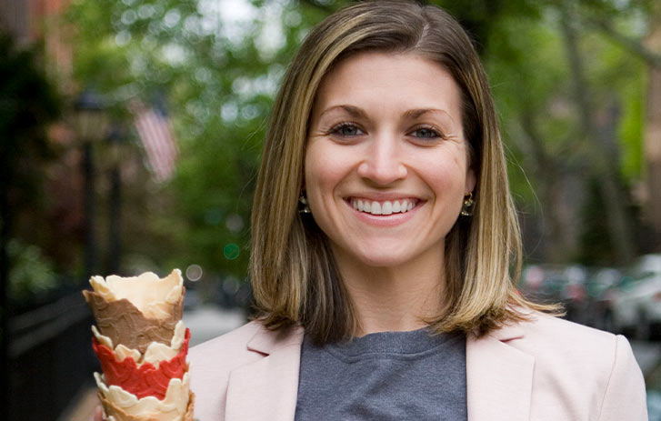 A photo of Kristine Tonkonow, founder of The Konery, holding a stack of ice cream cones