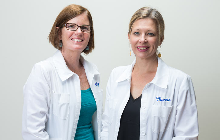 A photo of Kelly McCollum and Marcie Colledge, co-founders of Yellow Scope