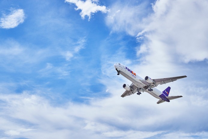 FedEx plane flying. 