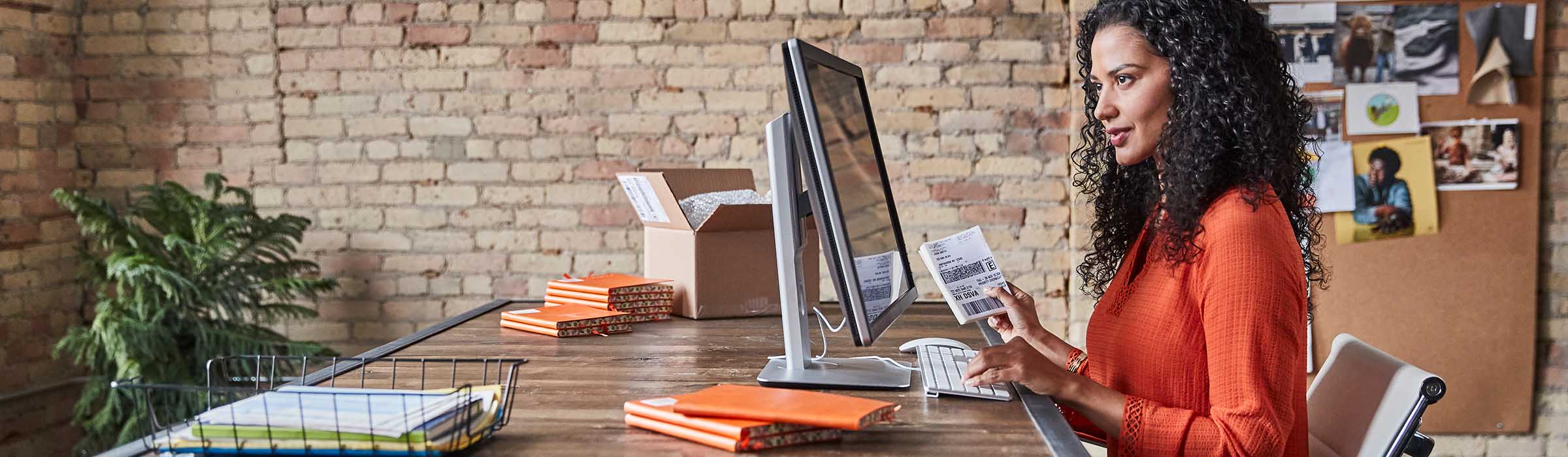 Woman using desktop computer