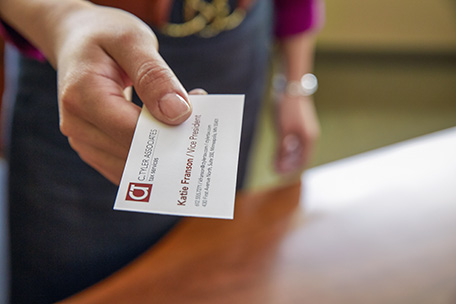 Person handing a business card