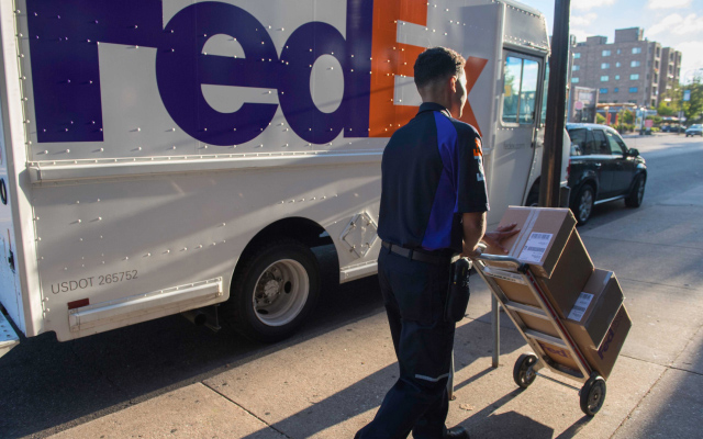 FedEx Ground truck parked outside of hospital delivering hazardous materials