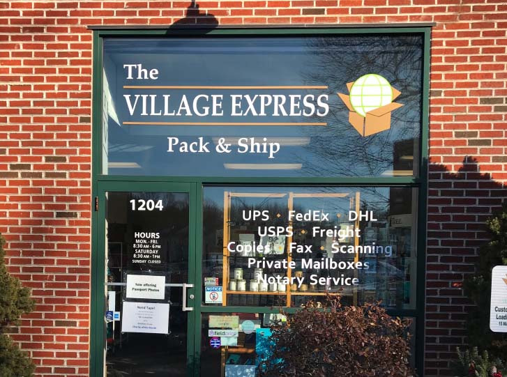 storefront of the Village Express shipping center. 